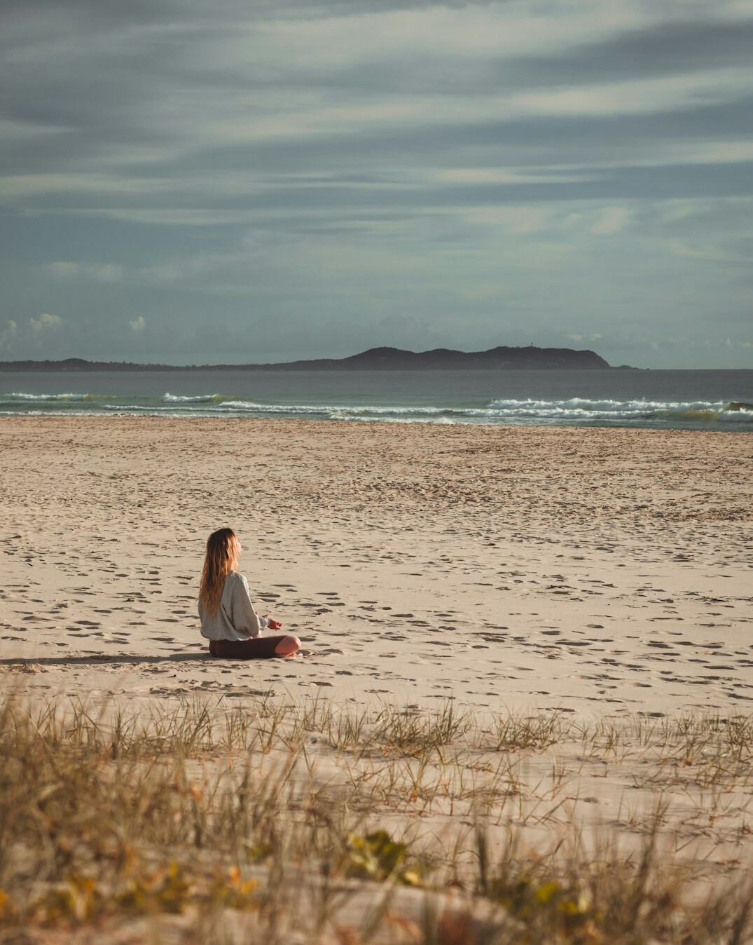 person meditating in nature