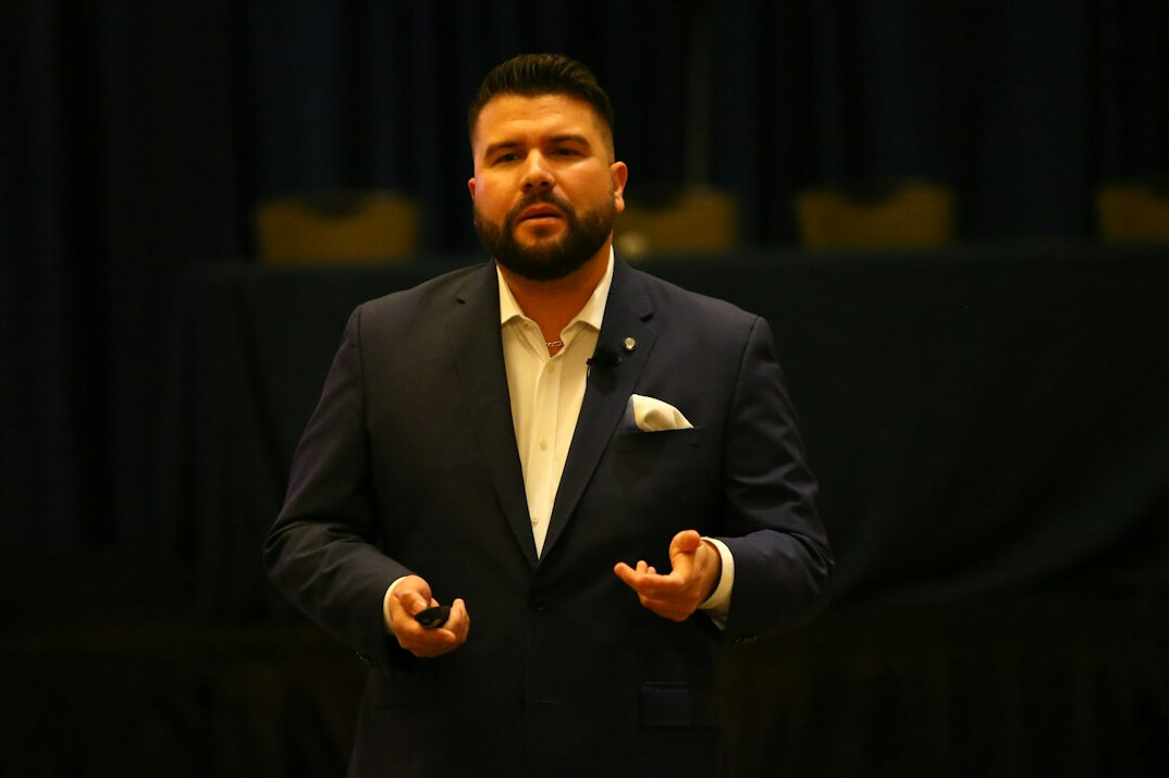 man giving speech to audience
