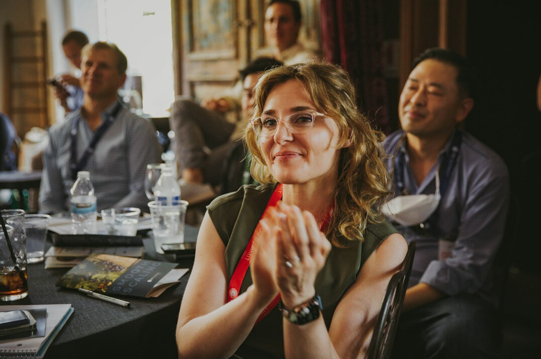 woman speaking confidently on stage
