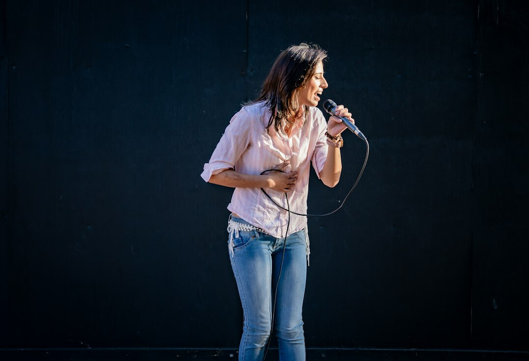 woman speaking confidently on stage