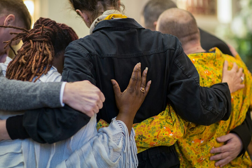 Diverse group of people having a supportive conversation in a circle