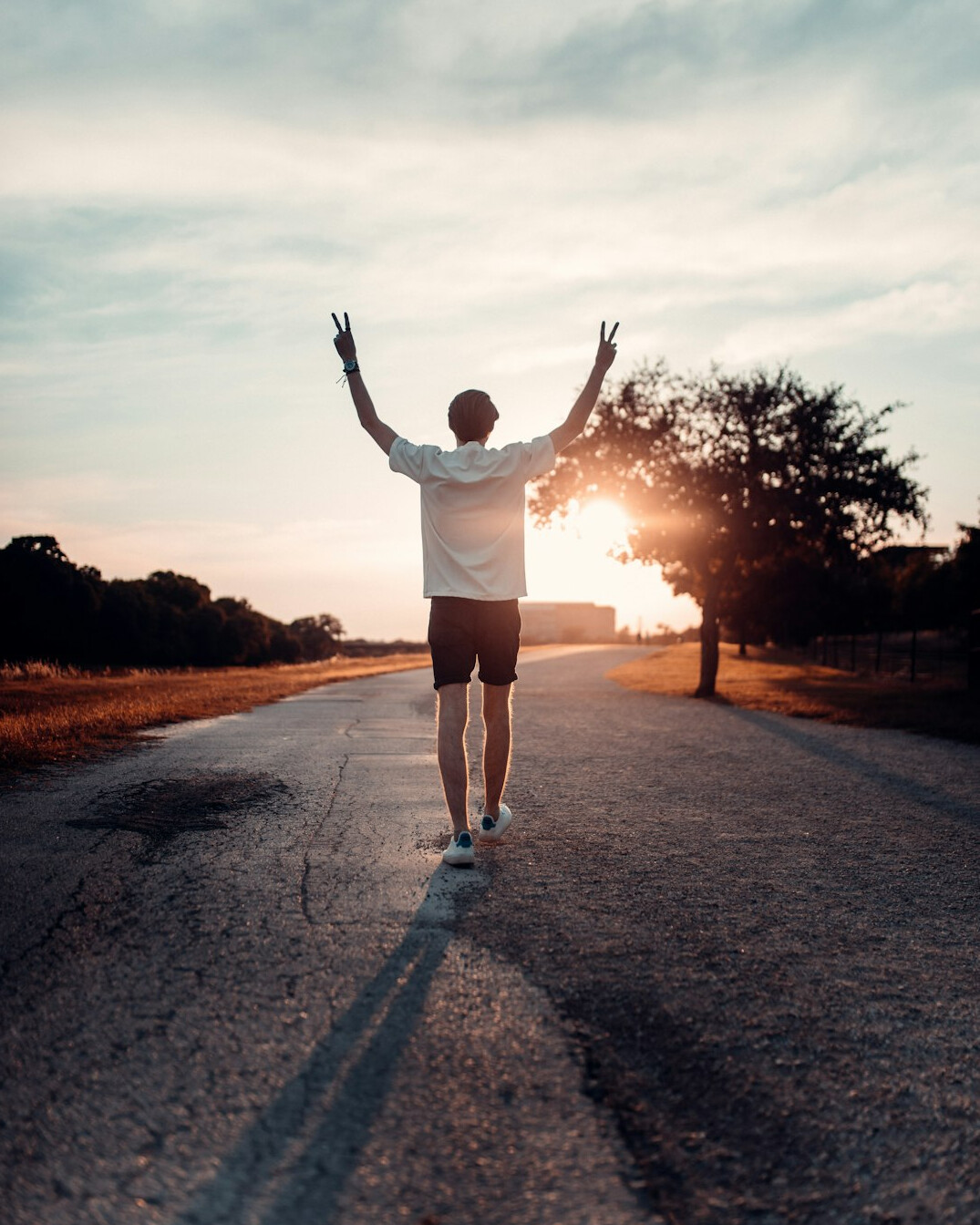person achieving goals outdoors